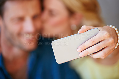 Buy stock photo Closeup of a happy couple taking a selfie together on a phone