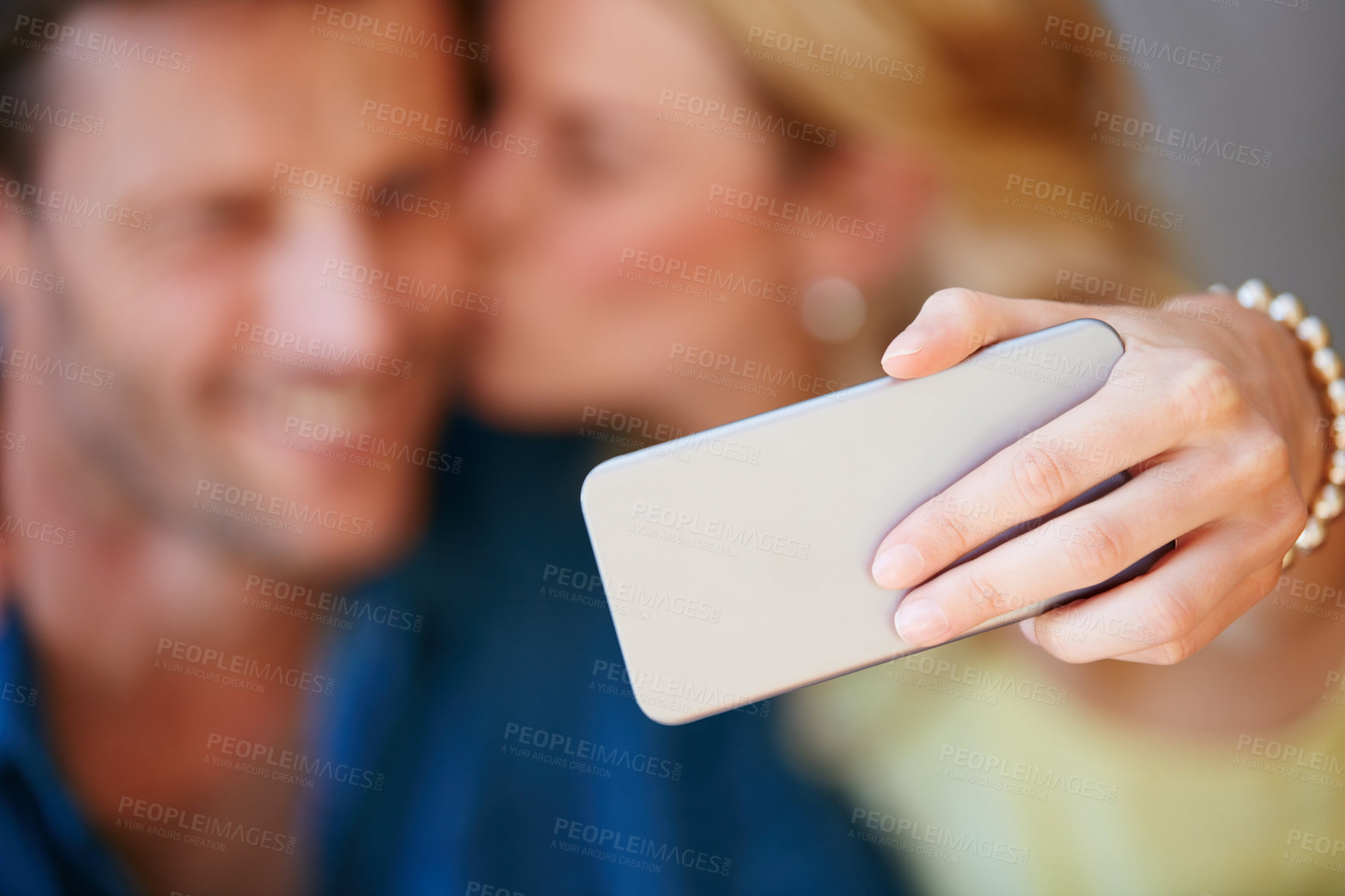 Buy stock photo Closeup of a happy couple taking a selfie together on a phone