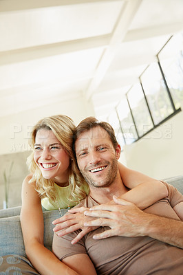 Buy stock photo Shot of a happy couple enjoying some free time together at home