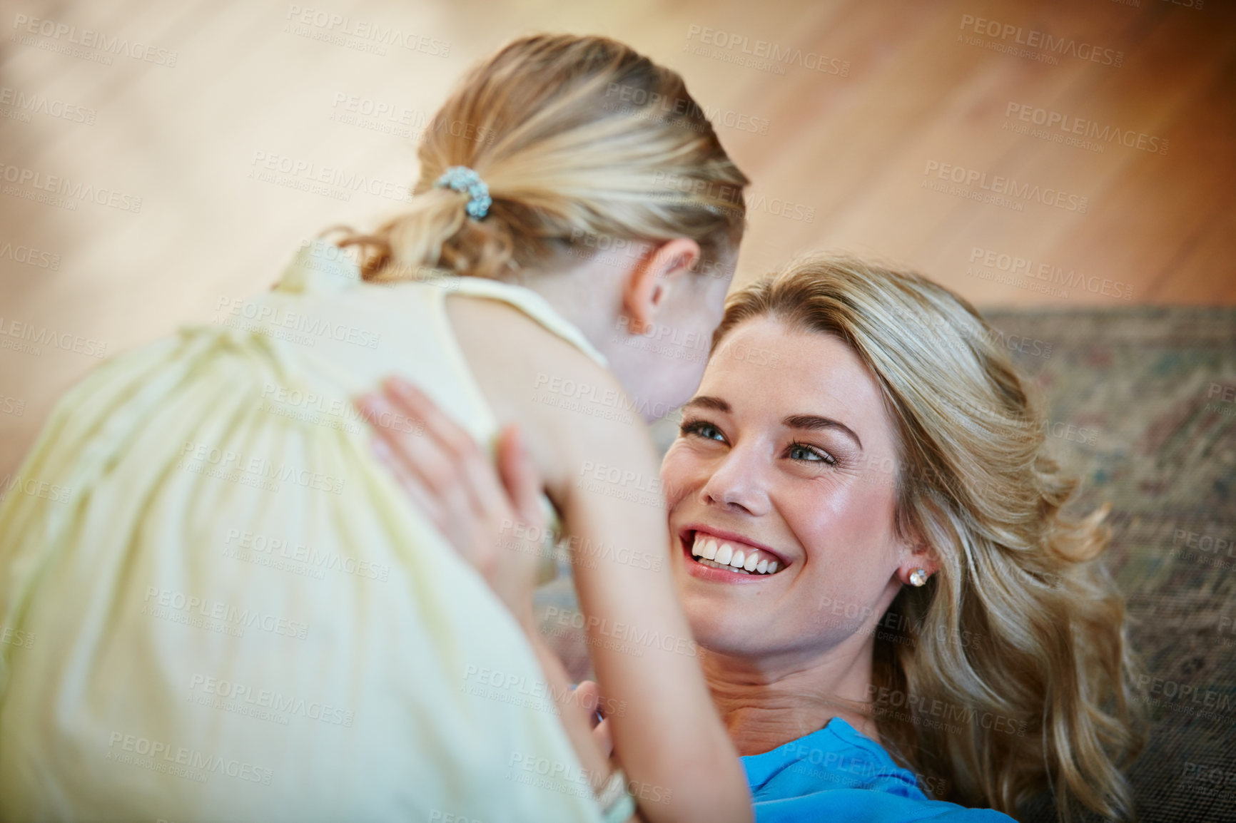 Buy stock photo Shot of a young mother playing with her daughter in their home