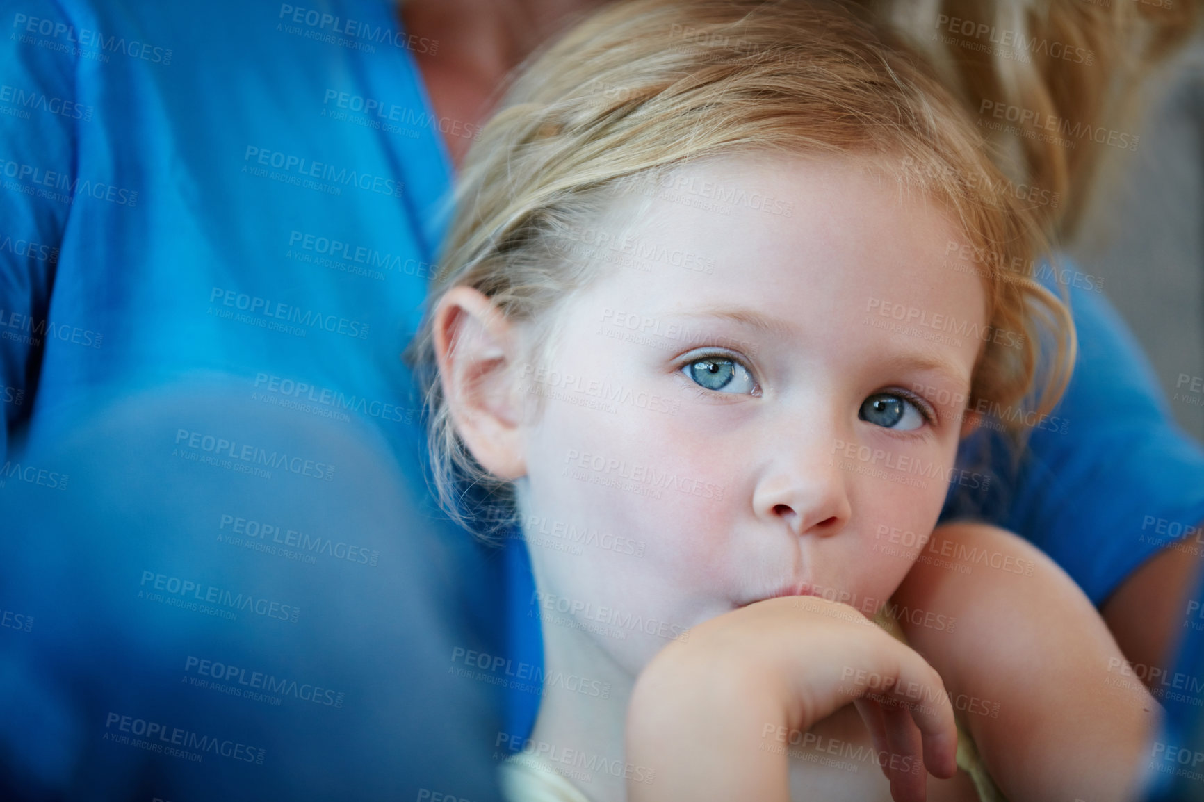 Buy stock photo Shot of a mother and her daughter sitting on the sofa at home