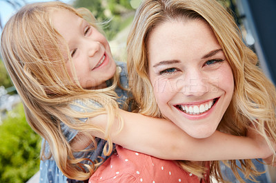 Buy stock photo Portrait of a mother and daughter spending quality time together outside