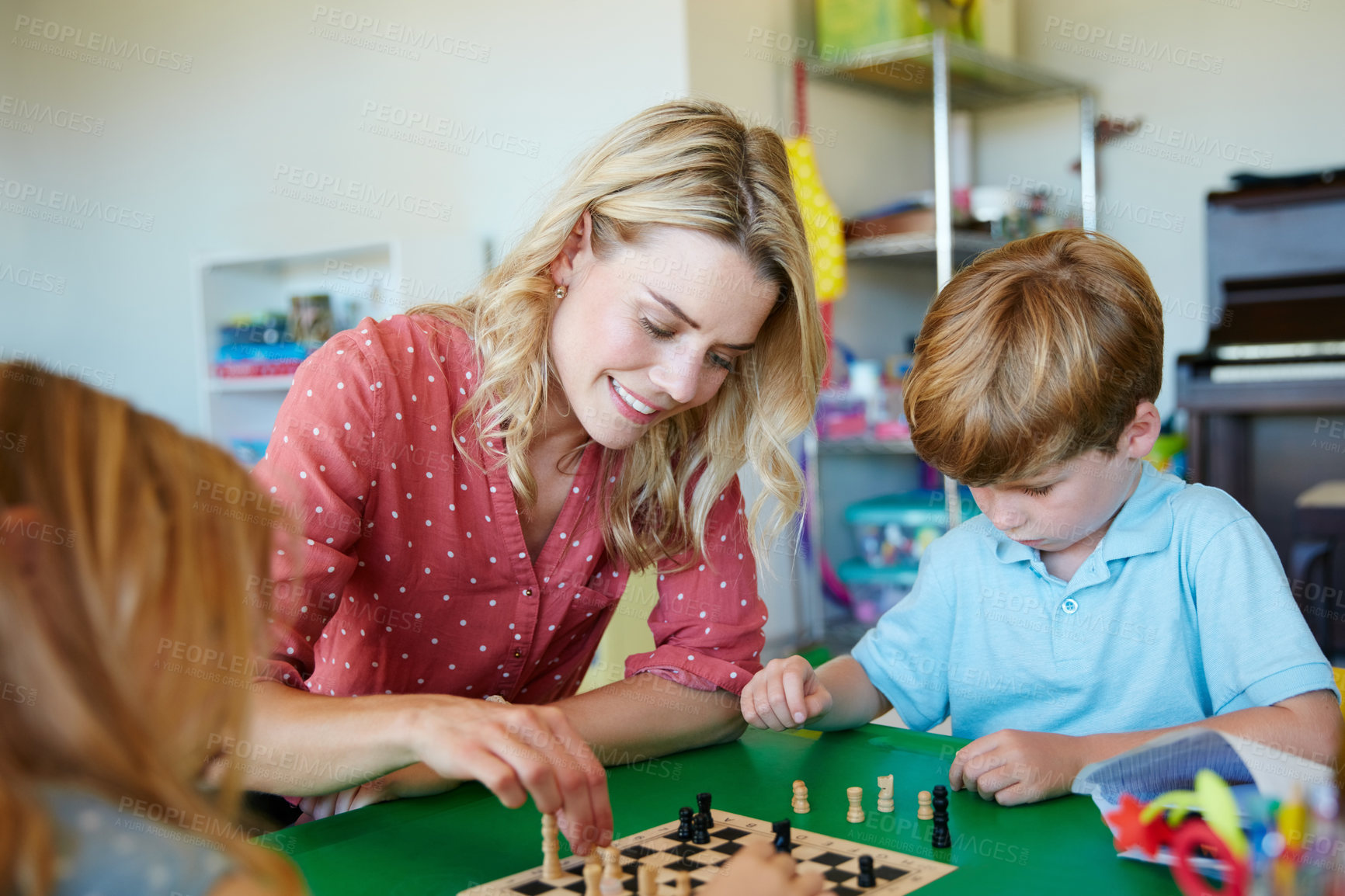 Buy stock photo Cropped shot of a mother having fun with her two kids at home