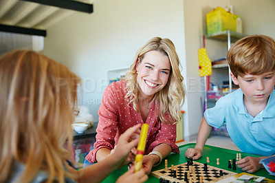 Buy stock photo Portrait of a mother having fun with her two kids at home