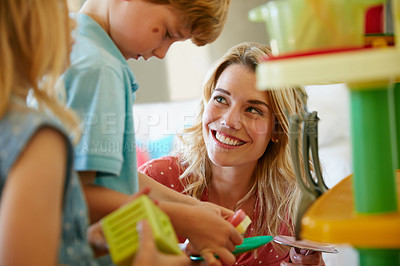Buy stock photo Cropped shot of a mother having fun with her two kids at home