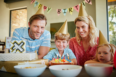 Buy stock photo Portrait of a happy family having a birthday party at home
