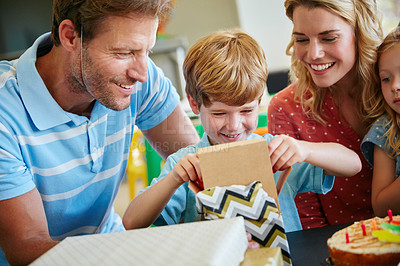 Buy stock photo Cropped shot of a happy family having a birthday party at home