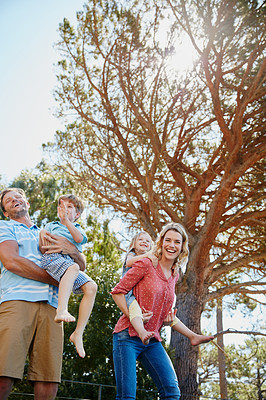 Buy stock photo Cropped shot of a family enjoying a day outdoors together