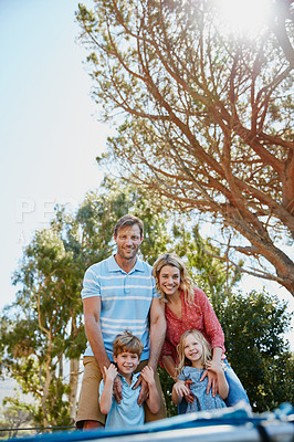 Buy stock photo Portrait of a family enjoying a day outdoors together