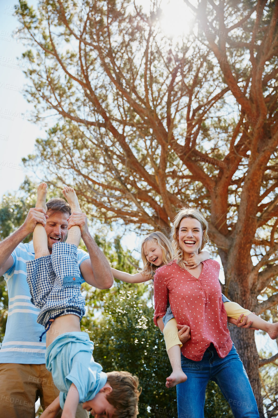 Buy stock photo Cropped shot of a family enjoying a day outdoors together