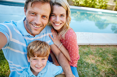 Buy stock photo Portrait of a happy family taking a self-portrait together outside