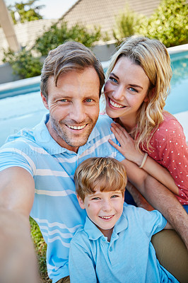 Buy stock photo Portrait of a happy family taking a self-portrait together outside