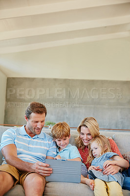 Buy stock photo Cropped shot of a family using a digital tablet together at home