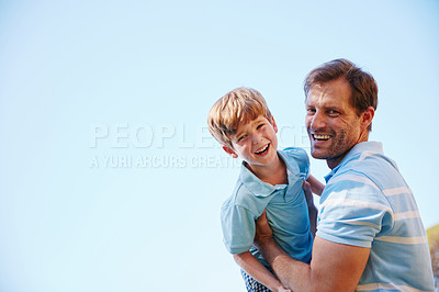 Buy stock photo Portrait of a father and son enjoying a day outdoors together