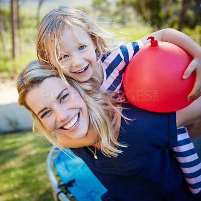 Buy stock photo Portrait of a mother and daughter enjoying a day outdoors together