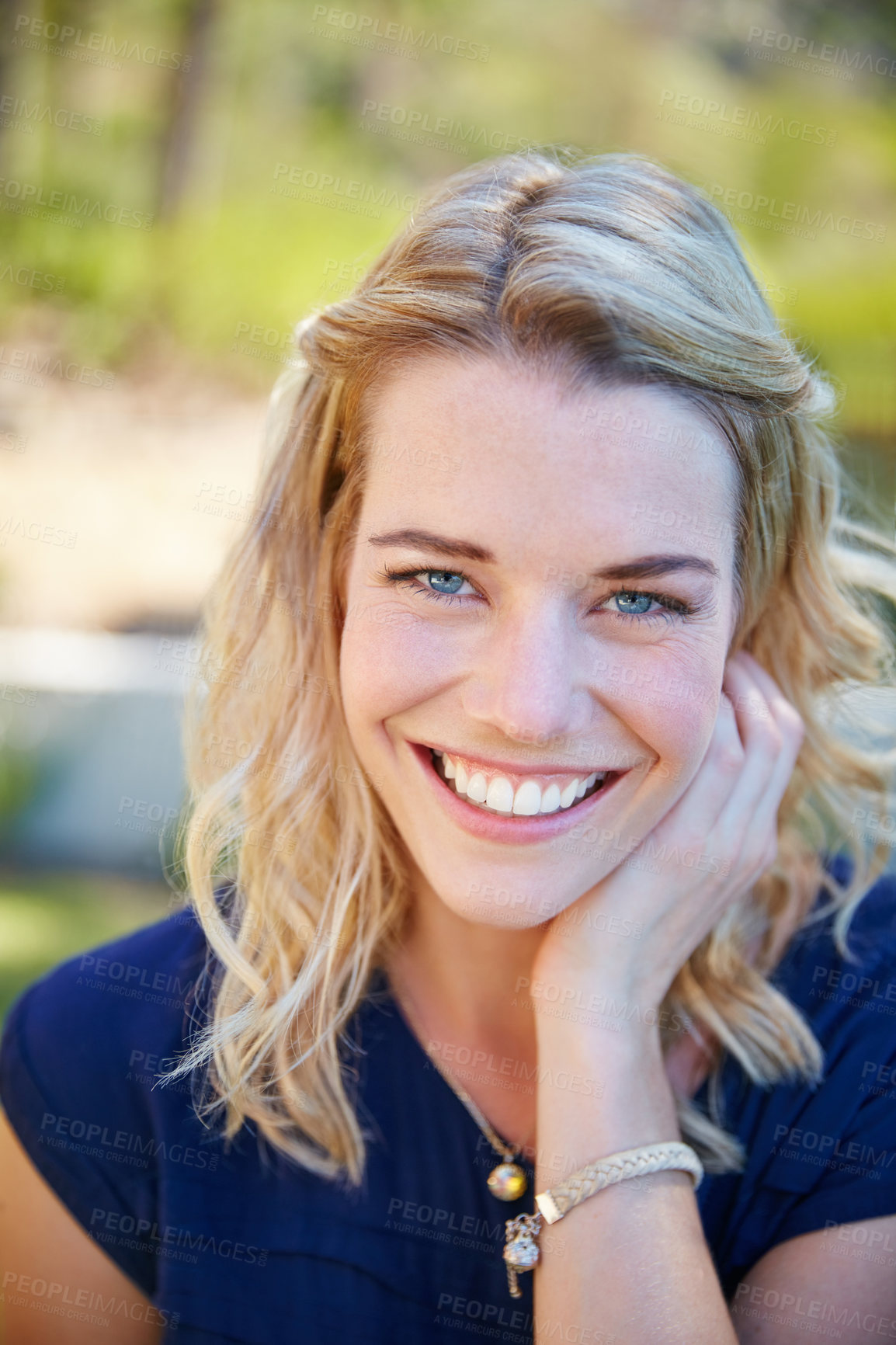 Buy stock photo Portrait of a beautiful young woman enjoying a day outside