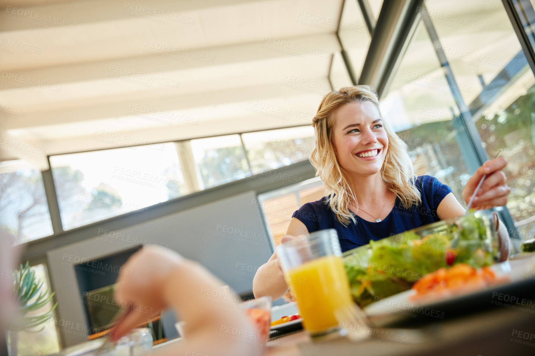 Buy stock photo Cropped shot of a family enjoying a meal together at home