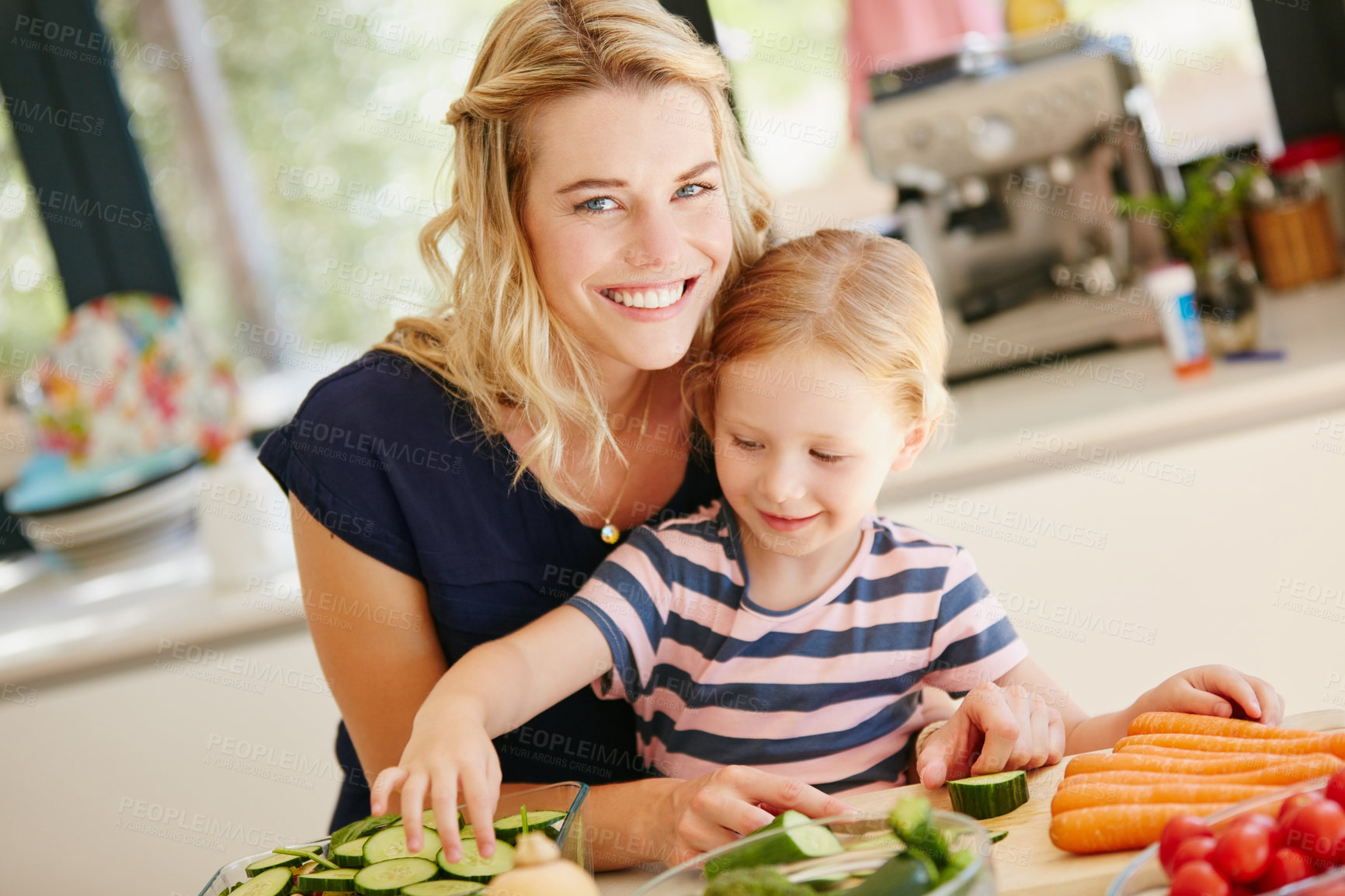 Buy stock photo Portrait of a mother and daughter preparing a meal together at home