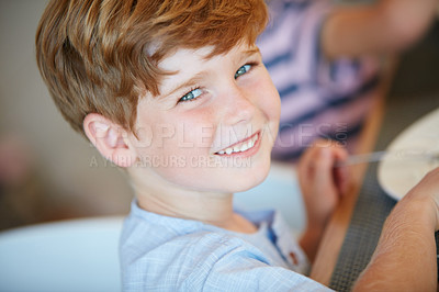 Buy stock photo Portrait of an adorable little boy enjoying a meal at home