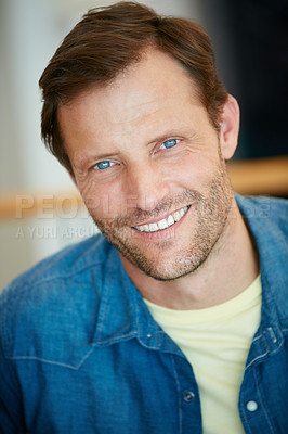 Buy stock photo Portrait of a handsome man enjoying his free time at home