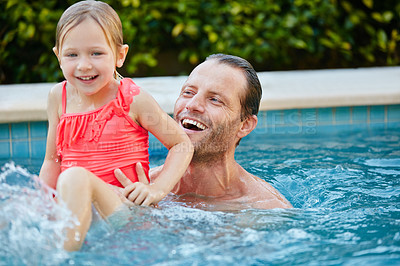 Buy stock photo Cropped shot of a father and daughter swimming in a pool together