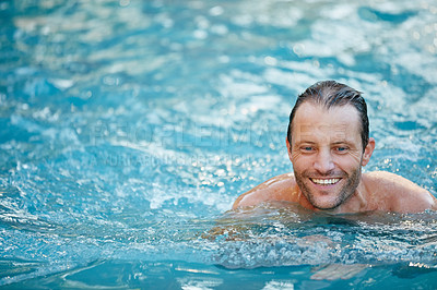Buy stock photo Cropped shot of a handsome man swimming in a pool