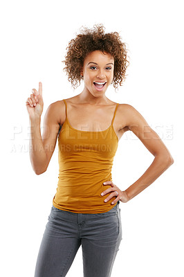 Buy stock photo Studio shot of an attractive young woman pointing towards something