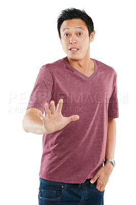 Buy stock photo Studio portrait of a young man holding out his hand against a white background