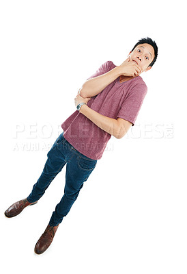 Buy stock photo Tilted studio portrait of a young man looking tense against a white background