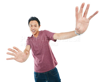 Buy stock photo Studio portrait of a young man reaching out with his hands against a white background