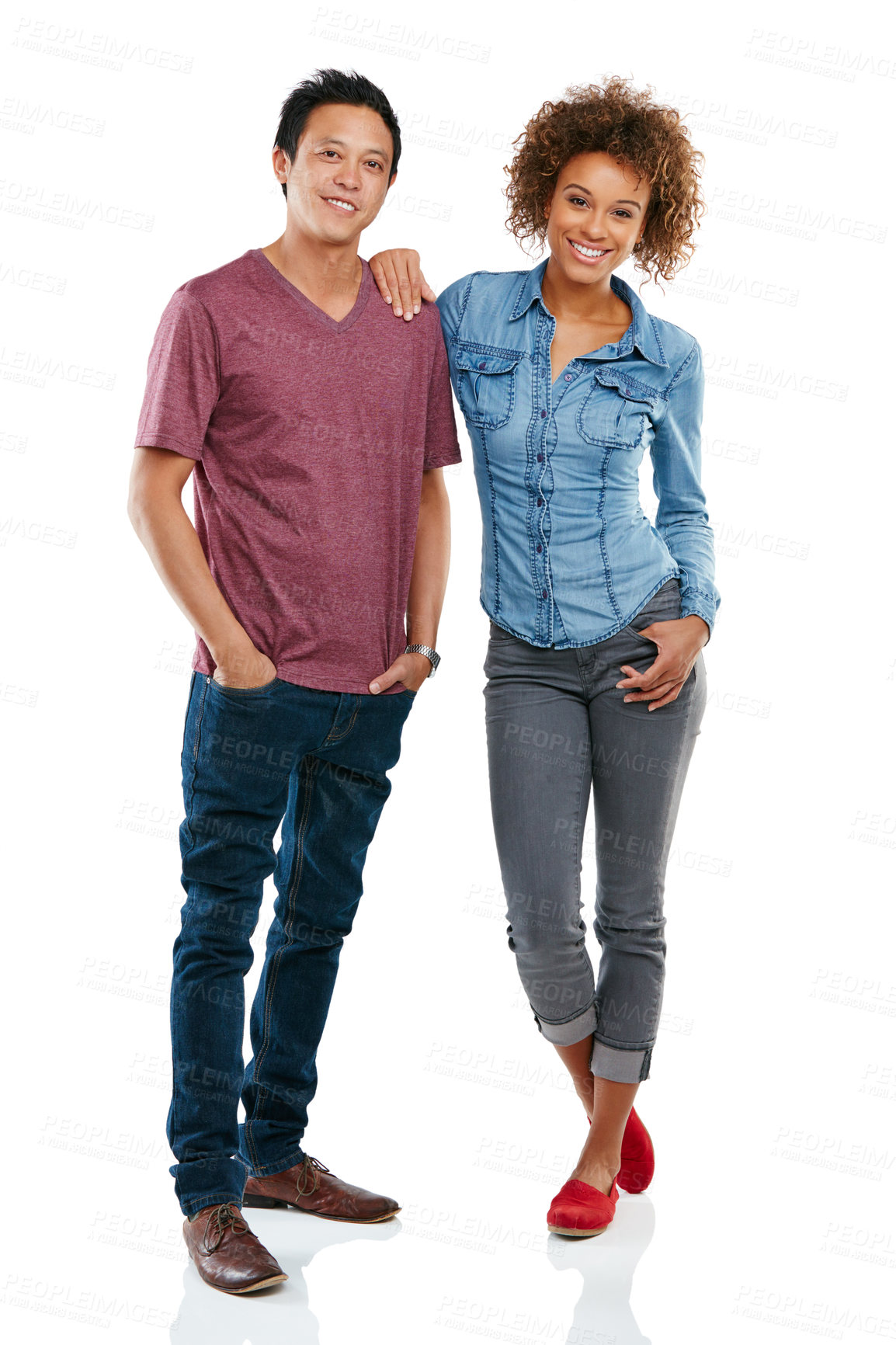 Buy stock photo Studio portrait of an affectionate young couple isolated on white