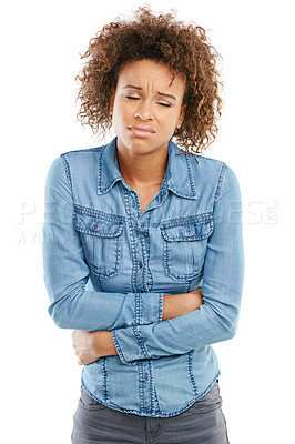 Buy stock photo Studio shot of a young woman experiencing stomach pain against a white background