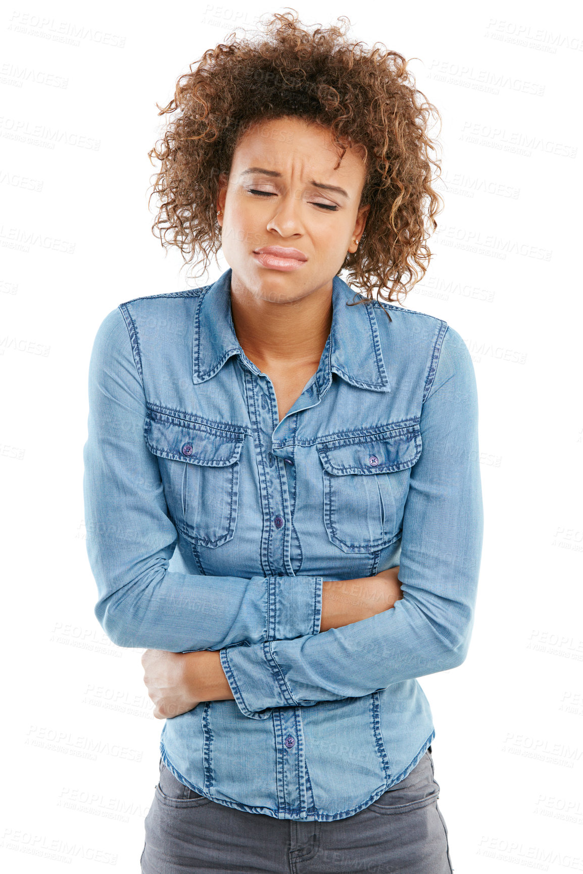 Buy stock photo Studio shot of a young woman experiencing stomach pain against a white background