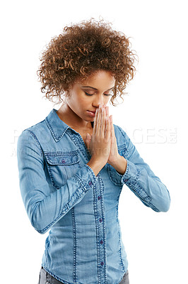 Buy stock photo Shot of a young woman standing with her hands together in a hopeful gesture