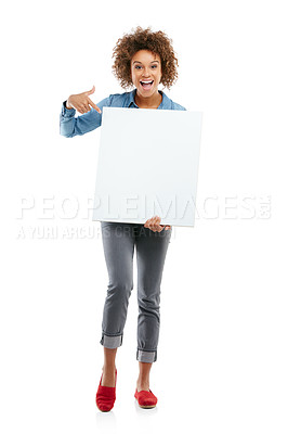 Buy stock photo Studio shot of an attractive young woman holding a placard