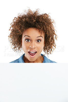 Buy stock photo Cropped shot of a young woman holding a placard