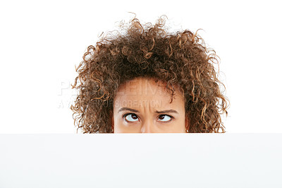 Buy stock photo Cropped shot of a young woman holding a placard