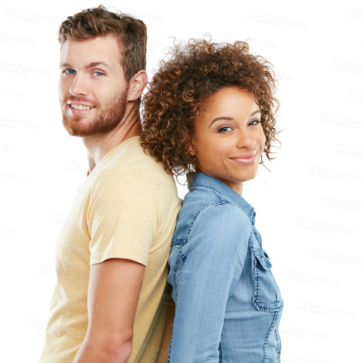 Buy stock photo Studio portrait of an affectionate young couple standing back to back against a white background