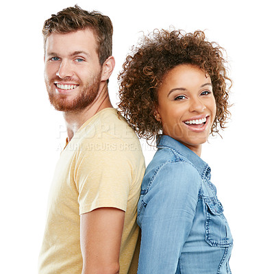 Buy stock photo Studio portrait of an affectionate young couple standing back to back against a white background