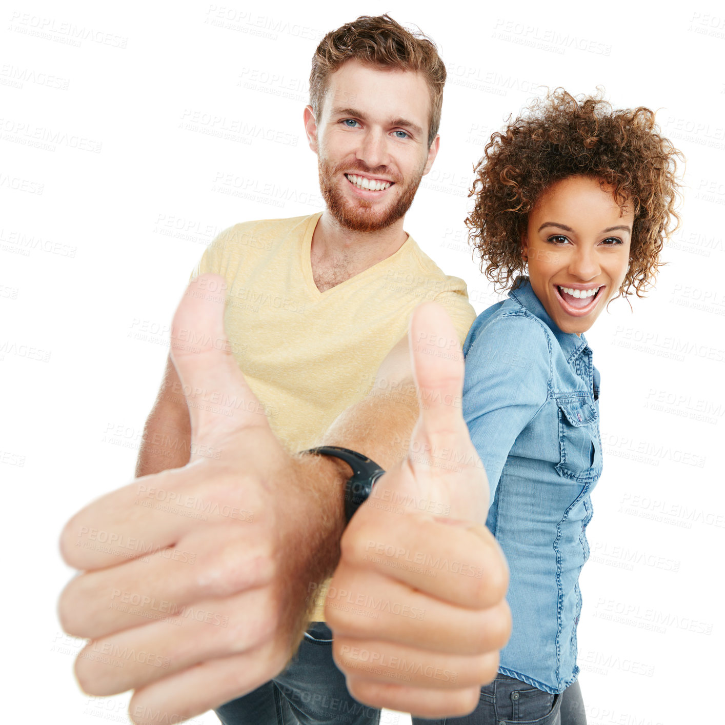 Buy stock photo Studio portrait of a young couple giving a thumbs up to the camera against a white background