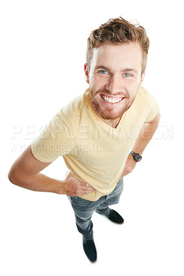 Buy stock photo Studio portrait of a young man looking up and smiling against a white background