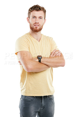 Buy stock photo Studio portrait of a young man posing with his arms folded against a white background