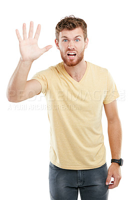 Buy stock photo Studio portrait of a young man holding up his hand against a white background