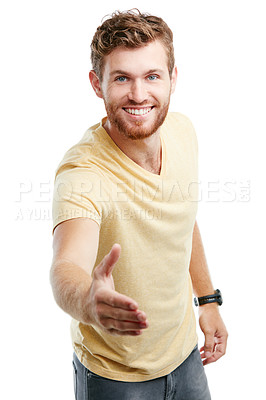 Buy stock photo Studio portrait of a young man holding out his hand for a handshake against a white background
