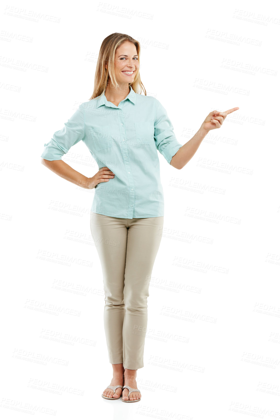 Buy stock photo Shot of a happy woman pointing at blank copyspace on a white background