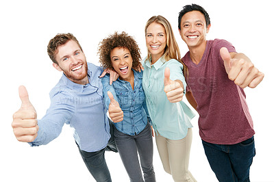 Buy stock photo Studio portrait of a group of friends giving thumbs up to the camera against a white background