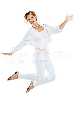 Buy stock photo Woman, excited and jumping happy in studio for freedom, positive mindset energy and isolated in white background. Female, smile and jump in air for happiness motivation, celebration or winner success