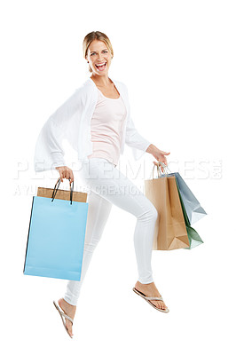 Buy stock photo Happy woman jump with bag from shopping, fashion and retail, customer in air isolated on white background. Smile in portrait, luxury designer brand and clothes, gift and discount sale with freedom