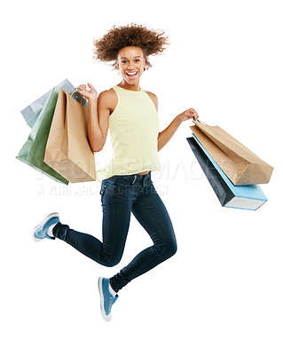 Buy stock photo Shopping bags, portrait and woman jumping in studio after an amazing discount, sale or promotion. Energy, excited and female model from Brazil with bags after a purchase isolated by white background.
