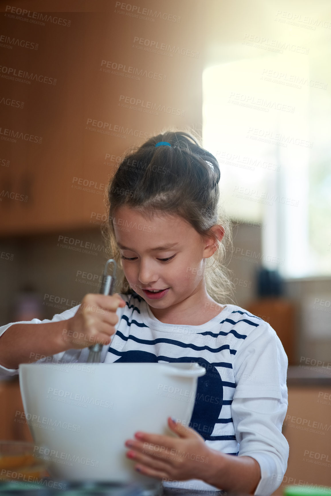 Buy stock photo Girl, baking and dessert with bowl on table for cupcake mixture, batter or cooking at home. Little child, kid or baker mixing sweet ingredients or food for cookies, delicious treat or meal at house